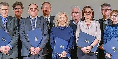 Sepp Hochreiter with the other members of Leopoldina smiling into the camera.
