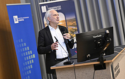 Bil AI Researcher Gerhard Friedrich speaking at the University meets Industry Event 2025.