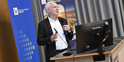 Bil AI Researcher Gerhard Friedrich speaking at the University meets Industry Event 2025.
